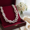 Braided 3 strand pearl necklace.